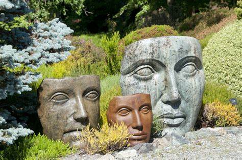 face sculpture Garden statues of 3 faces as masks