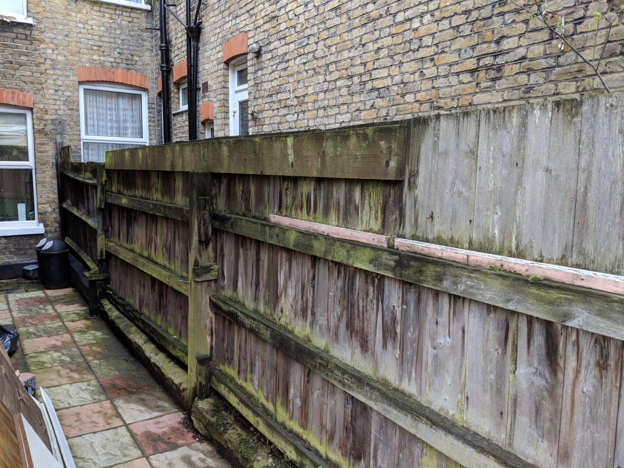 garden planning tips narrow gardens. thin narrow courtyard space with an ugly fence between tall houses