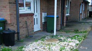 large cobble stones need hand-weeding; which is a pain! sad front